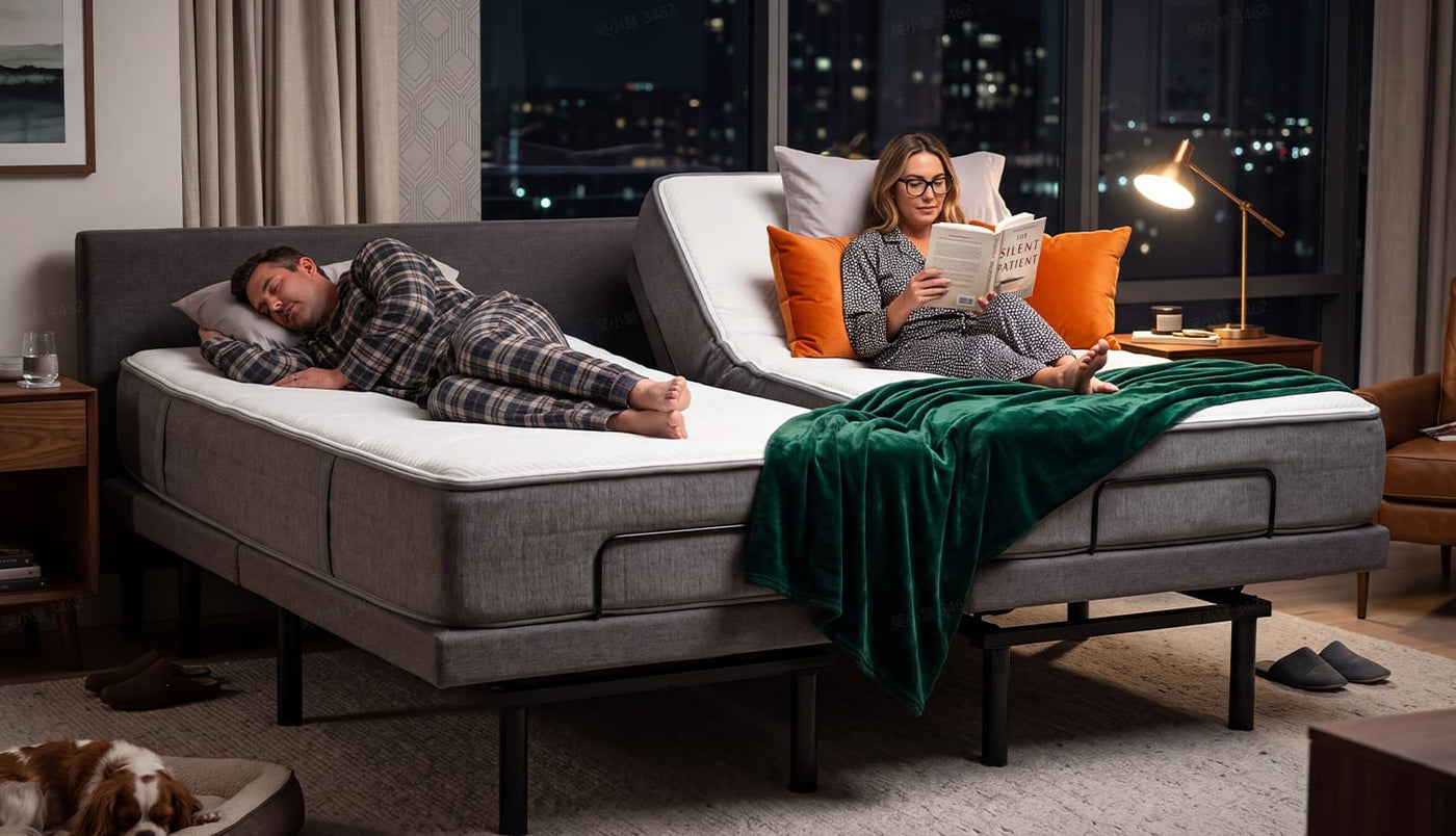 Couple on a split adjustable bed, one sleeping flat and one sitting up to read