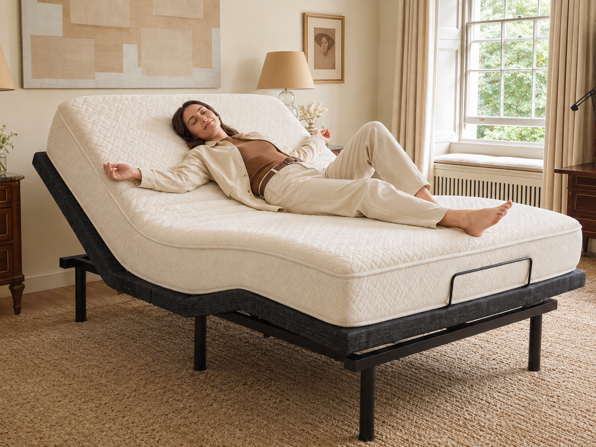 Woman resting on a Tami Tami adjustable bed frame