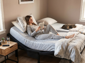 A woman resting in an adjustable bed